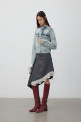 Bow-detailed washed blue denim jacket