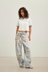 3D graffiti print curved-blade jeans
