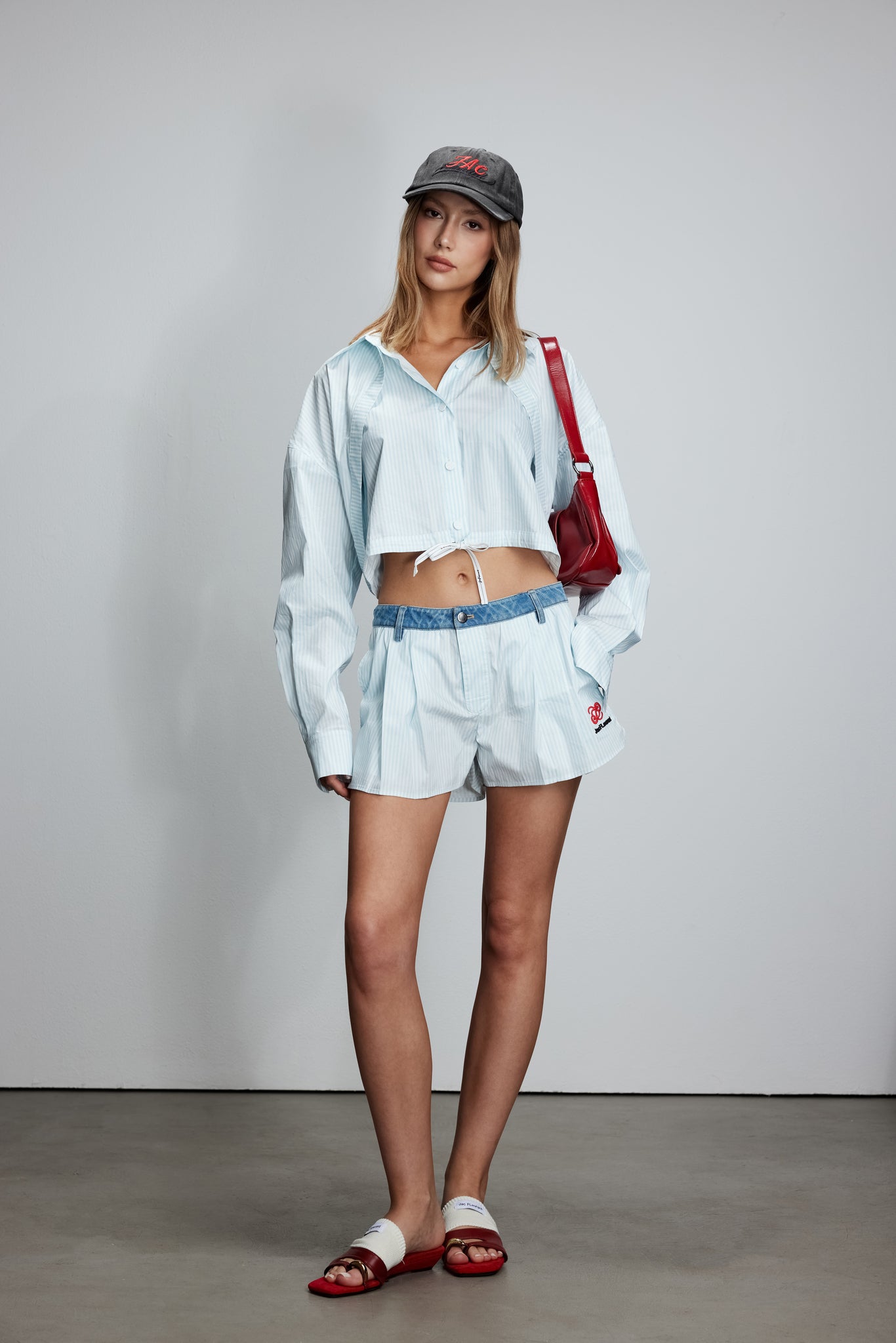 Two-piece striped tie-front shirt with denim patchwork pleated shorts