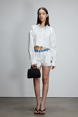Two-piece striped tie-front shirt with denim patchwork pleated shorts