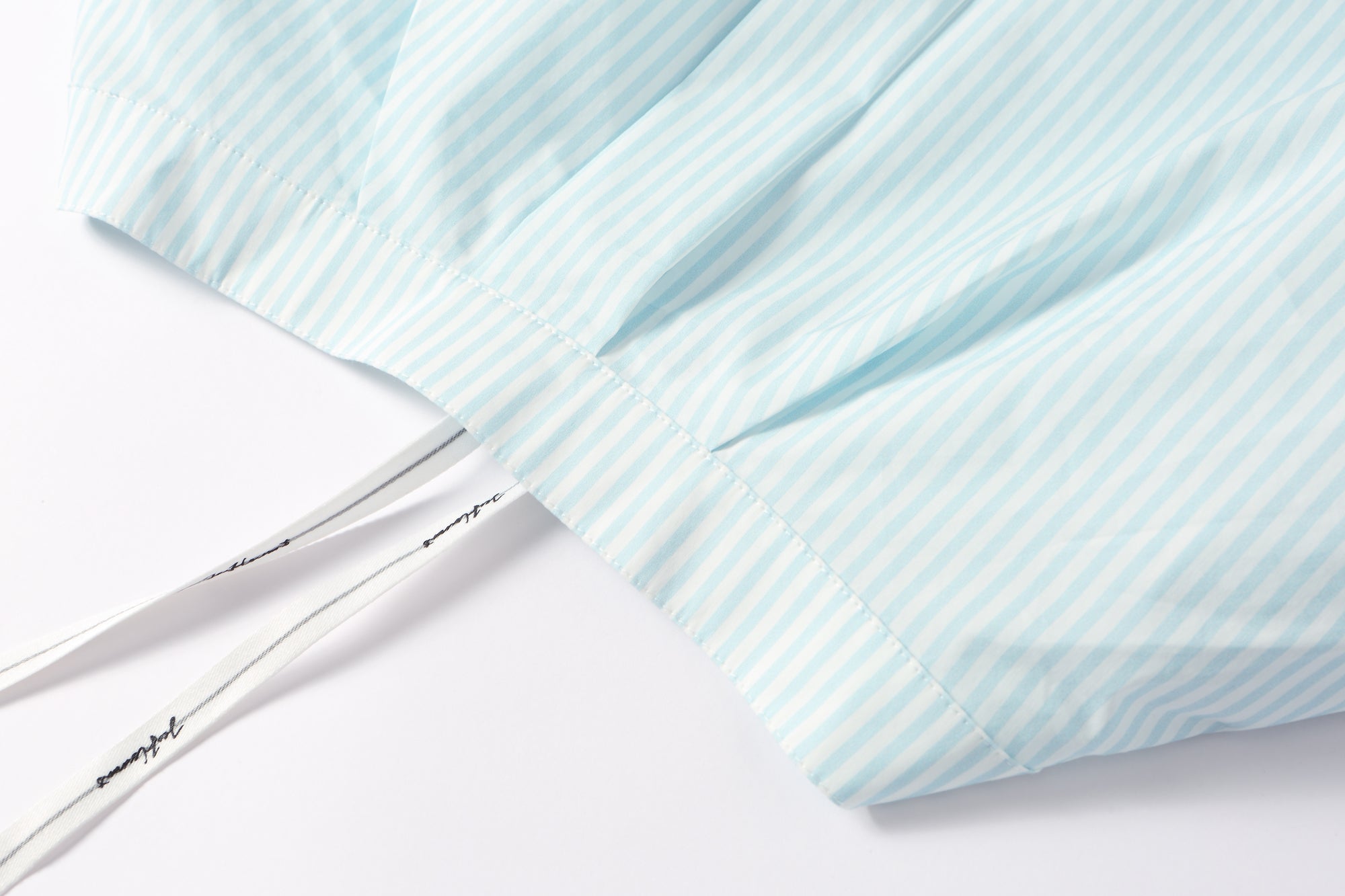 Two-piece striped tie-front shirt with denim patchwork pleated shorts