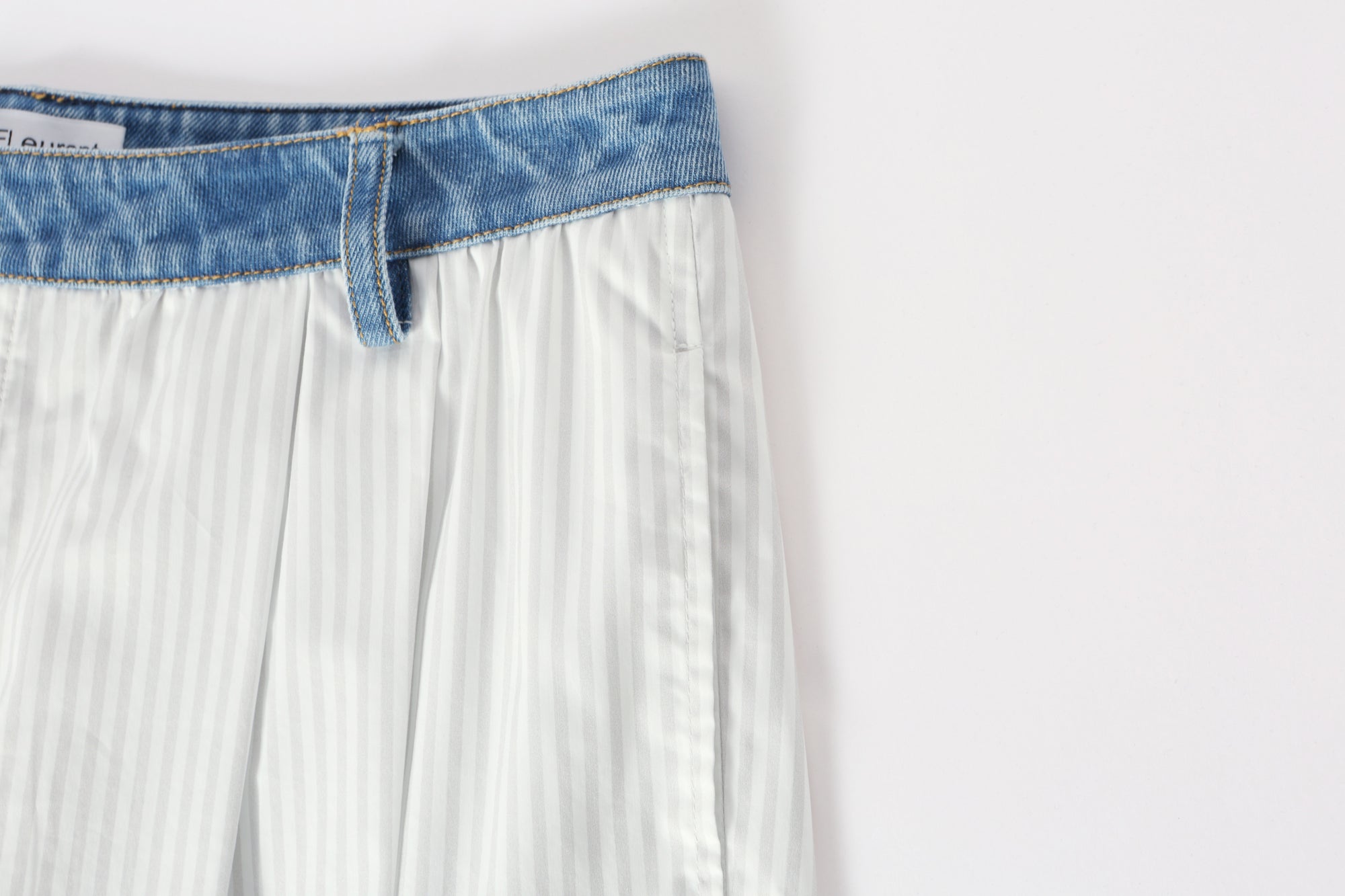 Two-piece striped tie-front shirt with denim patchwork pleated shorts