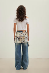 Newspaper graffiti logo print tie-detail blue ripped jeans